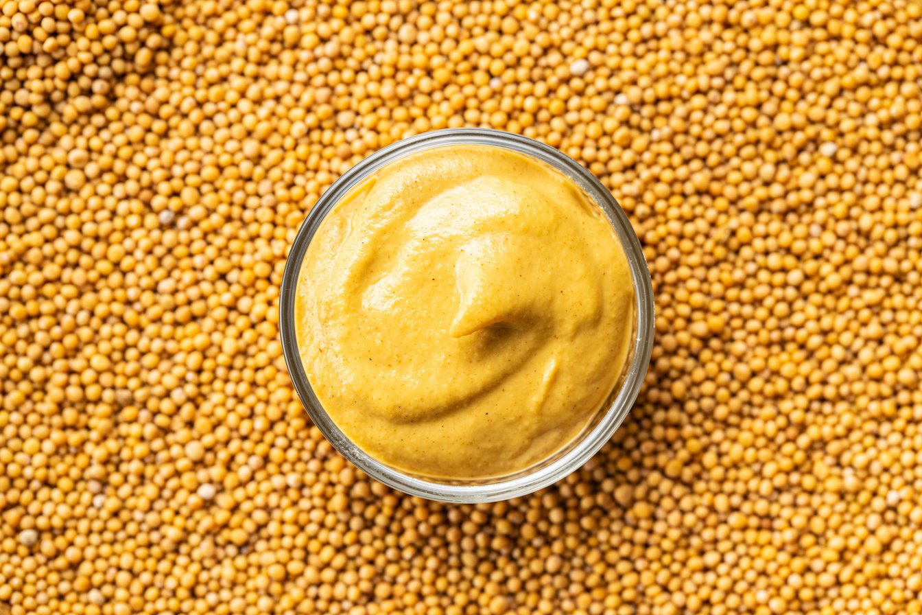 Yellow mustard and mustard seeds.